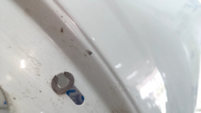 Front right fender of a 2015 Ford Bronco Sport, gray NE, chip, scratch