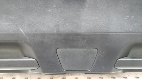Black lower tailgate trim for a 2021-2025 Ford Bronco Sport with lamps and handles, scratches, and wear.