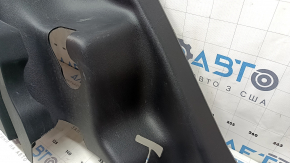 Left arch trim for a 2021-2025 Ford Bronco Sport, black, with hooks, scratches, and wear.