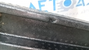 The right trunk tray of the Ford Bronco Sport 21-25 is dented and has tears.