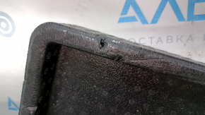 The right trunk tray of the Ford Bronco Sport 21-25 is dented and has tears.