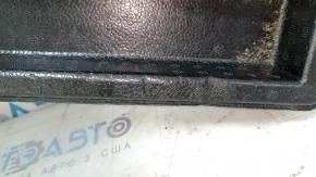 The right trunk tray of the Ford Bronco Sport 21-25 is dented and has tears.