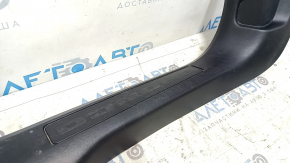 Front left door sill plate for a 2021-2025 Ford Bronco Sport, black, scuffs and scratches, needs cleaning.