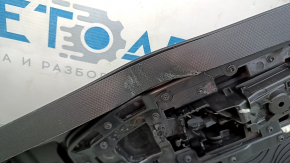 Black rear right door panel for a 2021 Ford Bronco Sport with a handle, gray molding, black leather armrest, plastic insert, scratches, scuffs, dents