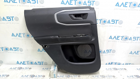Black rear left door panel for a 2021 Ford Bronco Sport with a handle, gray molding, black leather armrest, plastic insert, scratches, dented leather