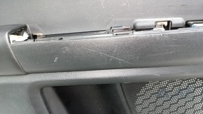 Black rear left door panel for a 2021 Ford Bronco Sport with a handle, gray molding, black leather armrest, plastic insert, scratches, dented leather