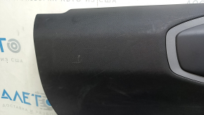 Black rear left door panel for a 2021 Ford Bronco Sport with a handle, gray molding, black leather armrest, plastic insert, scratches, dented leather