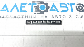 The QUATTRO emblem on the tailgate of the Audi Q8 19-25