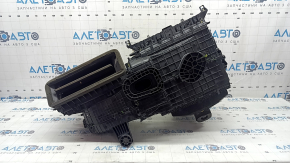 The bare heater housing of a 2015 Ford Bronco Sport, assembled in 3 parts, is broken.