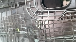 The bare heater housing of a 2015 Ford Bronco Sport, assembled in 3 parts, is broken.