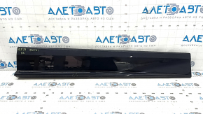 Lower front right door trim for an Audi Q8 19-25, black, scratches, dents
