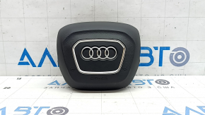 The Audi Q8 19-25 driver's steering wheel airbag is black and scratched.
