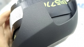 The Audi Q8 19-25 driver's steering wheel airbag is black and scratched.