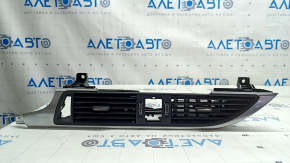 The central air vent for the front panel of the Audi A6 C7 16-18 is black, with a chrome trim, bumps on the chrome, scratches