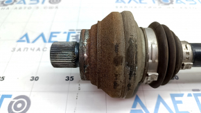 The rear left half-shaft of a Volkswagen ID.4 21-22 is rusty.