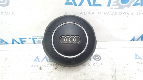The steering wheel airbag for the driver's side of the Audi A6 C7 12-18 is black and scratched.
