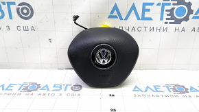 Black, worn steering wheel airbag for the driver's side of a VW Jetta 19-24.
