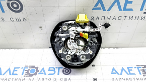 Black, worn steering wheel airbag for the driver's side of a VW Jetta 19-24.