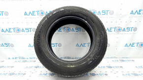 The 2020 Yokohama Avid Ascend GT 5mm R15 195/65 all-season tire is cracked and cut.