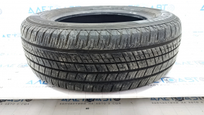 The 2020 Yokohama Avid Ascend GT 5mm R15 195/65 all-season tire is cracked and cut.