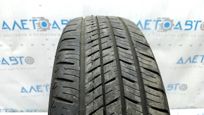 The 2020 Yokohama Avid Ascend GT 5mm R15 195/65 all-season tire is cracked and cut.