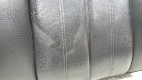 The driver's seat back upholstery for the Audi A6 C7 12-18 is black leather, heated, worn, has scratches, cracks, and needs dry cleaning.