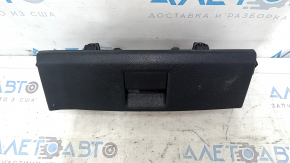 The Audi A6 C7 12-18 black under-seat storage compartment has scratches and cracks in the mounting points.