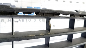The lower grille of the front bumper of the VW Jetta 19-21 is dented