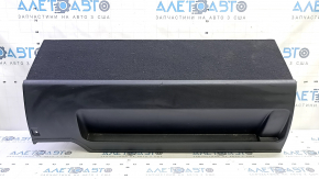 The battery cover of a 15-17 Toyota Prius V is black and scratched.