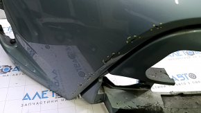 Bare front bumper for a Toyota Prius V 15-17, green, dents, peeling paint, cracks in the mounts