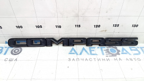 Emblem with the inscription COMPASS on the front left door of the Jeep Compass 17-24, black gloss