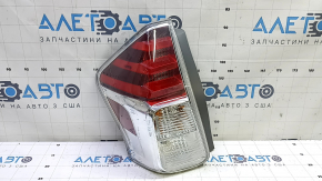 Left headlight for a 2015-2017 Toyota Prius V, scratches