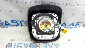 The driver's side airbag in the Jeep Compass 22-25 is black and has a rusty squib.