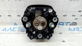 The Honda CRV 23-25 driver's steering wheel airbag is black and has a rusty squib.