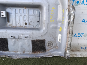 The trunk trough of the Ford Escape MK4 20-25 hybrid has been drilled out.
