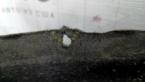 The rear right fender liner of an Alfa Romeo Stelvio 18-25 has a torn fastener.