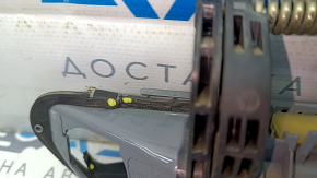 The outer front left door handle of a Volkswagen ID.4 21-22 keyless entry system is cracked and missing a component. The latch is broken.