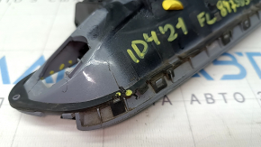 The outer front left door handle of a Volkswagen ID.4 21-22 keyless entry system is cracked and missing a component. The latch is broken.