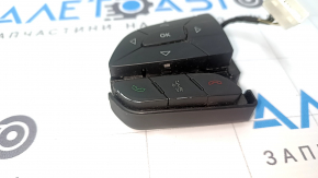 The left steering wheel control buttons on a Jeep Cherokee KL 14-23 are worn out.