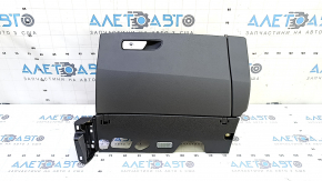 The glove compartment of the Audi Q7 2016-2017 is black and has a broken mount.