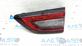 The right inner taillight of the Ford Escape MK4 2023-2024 has cracks, glue, and scratches.