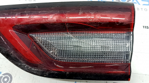 The right inner taillight of the Ford Escape MK4 2023-2024 has cracks, glue, and scratches.