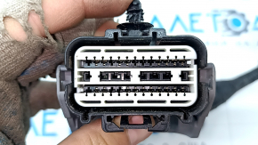 The wiring harness for the front bumper of a Ford Escape MK4 23-25 for parking sensors, a camera, an ambient air temperature sensor, a central light, and fog lights is broken.
