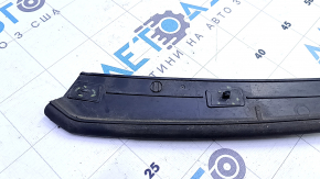 The front hood seal on an Audi Q7 16-25 has broken fasteners.