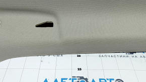 Headlining for a 2021-22 Nissan Rogue without a sunroof, gray, with a rear ceiling light, needs cleaning, creases
