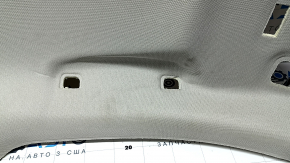 Headlining for a 2021-22 Nissan Rogue without a sunroof, gray, with a rear ceiling light, needs cleaning, creases