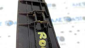 The rear right roof lining of a 2021 Nissan Rogue has a broken mount.