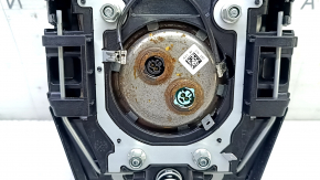 The driver's steering wheel airbag for a Toyota Prius 50 16-22 is black and has a rusty squib.