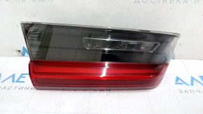 The inner tailgate light, left, BMW 3 G20 19-21, is worn, and has a bump.