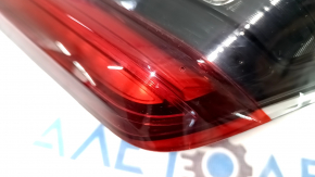 The inner tailgate light, left, BMW 3 G20 19-21, is worn, and has a bump.
